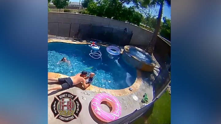 Moment firefighter saves one-year-old son from drowning