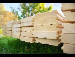 Guard charged with stealing lumber